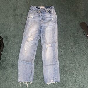 Light-wash asymmetrical waistline jeans